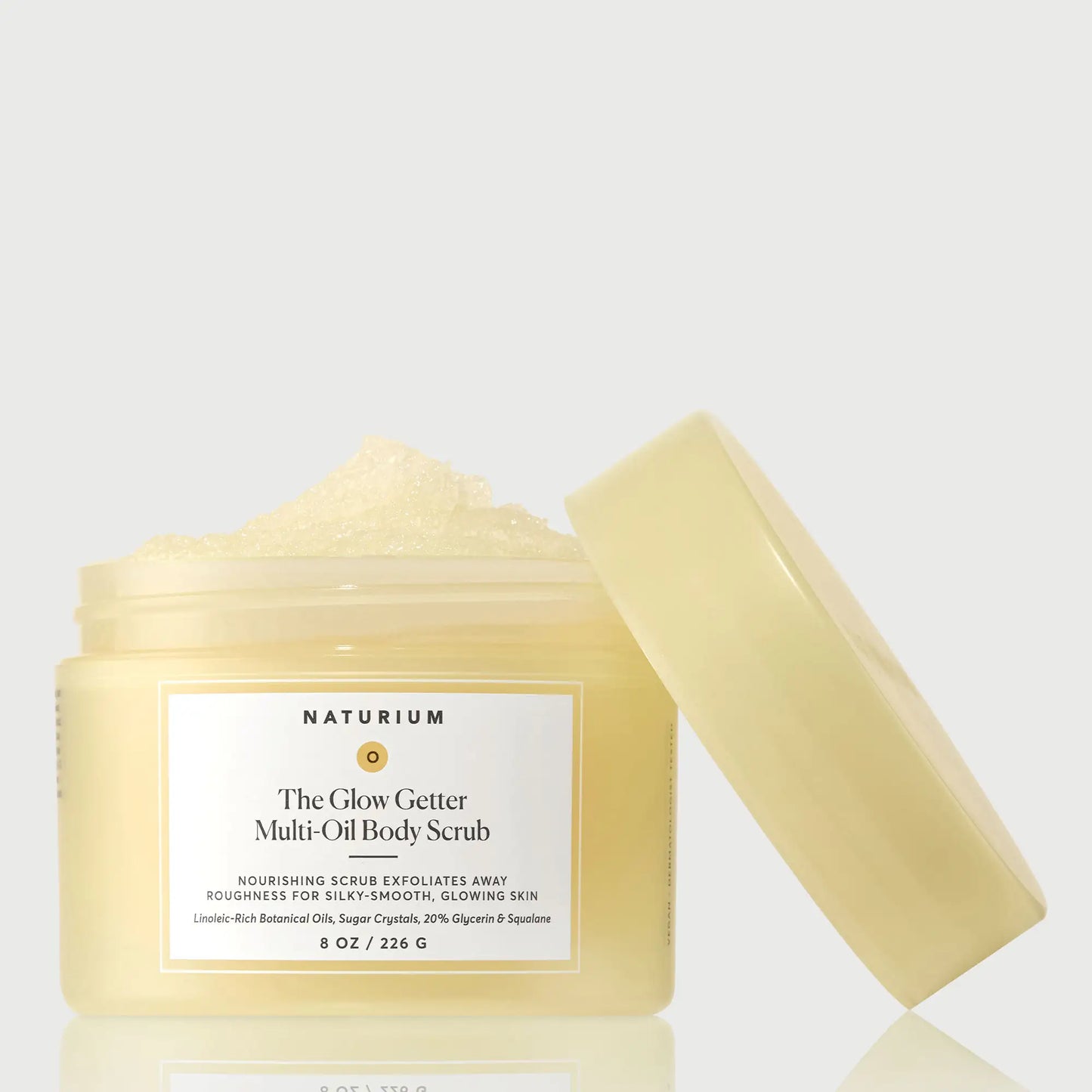 the-glow-getter-multi-oil-body-scrub-j7 NATR-40028-GlowGetter-Multi-Oil-Body-Scrub-Front-CapOff-bonebkgd.webp