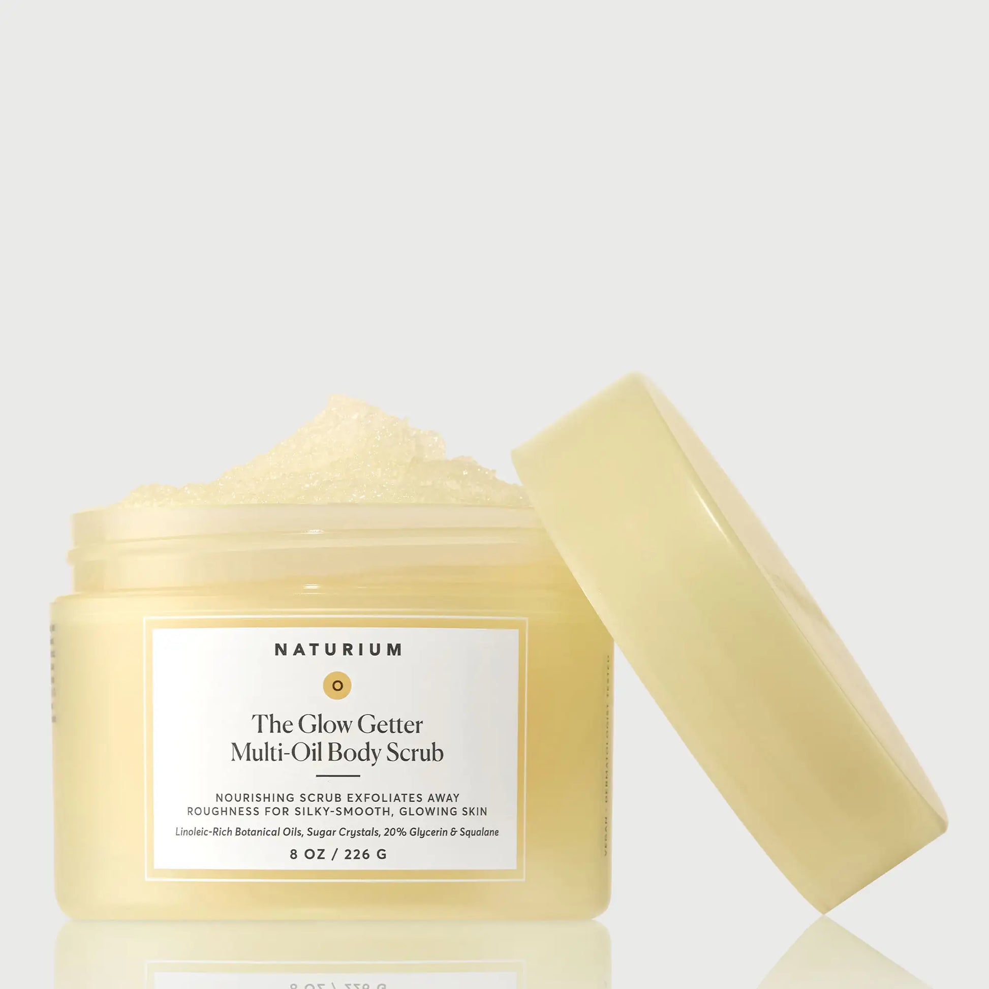 the-glow-getter-multi-oil-body-scrub-j7 NATR-40028-GlowGetter-Multi-Oil-Body-Scrub-Front-CapOff-bonebkgd.webp
